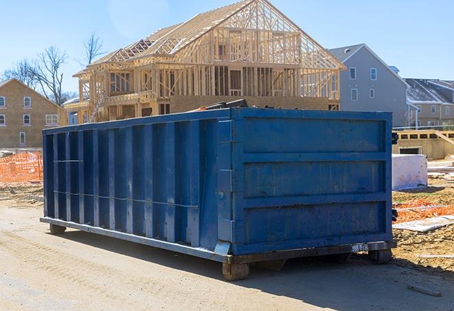 dumpsters ready for residential garbage collection